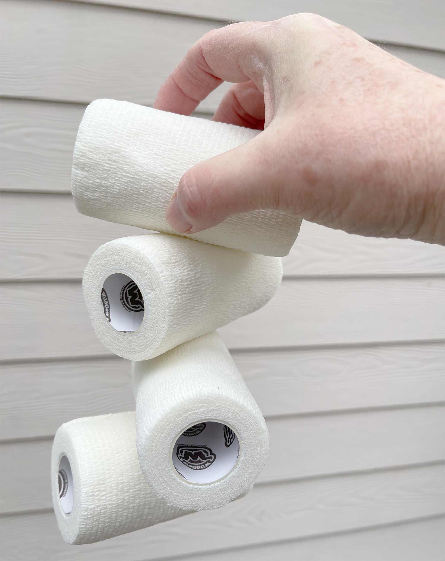 WildCow 4 Inch White Vet Wrap Rolls Showing Stickiness