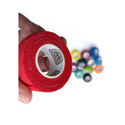 WildCow 1 Inch Multicolored Vet Wrap - 24/48 Packs - Red roll held in hand