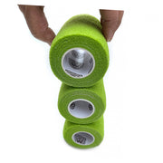 3 of 12 Rolls of WildCow 3 Inch Grass Green Vet Wrap Demonstrating Adhesiveness