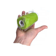 Hand holding one roll of WildCow 4 Inch Grass Green Vet Wrap