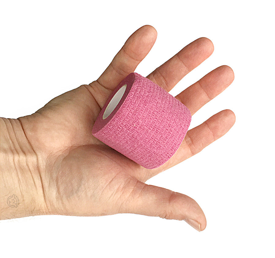 Hand with One Roll of WildCow Pink 2 Inch Vet Wrap